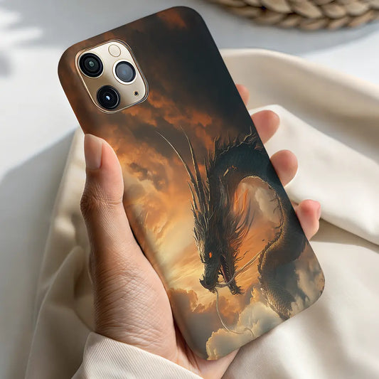 In-hand lifestyle shot of someone holding the Dragon of the Dusk case, highlighting the glowing dragon eyes and twilight clouds.