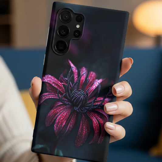 In-hand lifestyle shot holding the Red Mum case with rich red petals and matte protective finish.