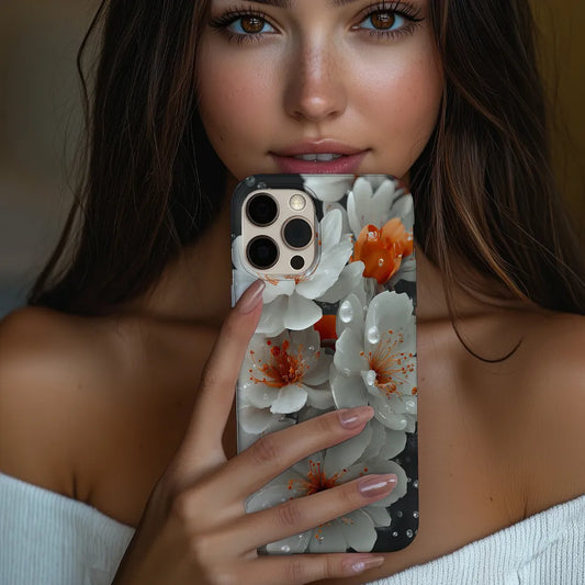 White cherry blossom phone case held in hand, showing calm floral artwork with natures soft detail in everyday use.