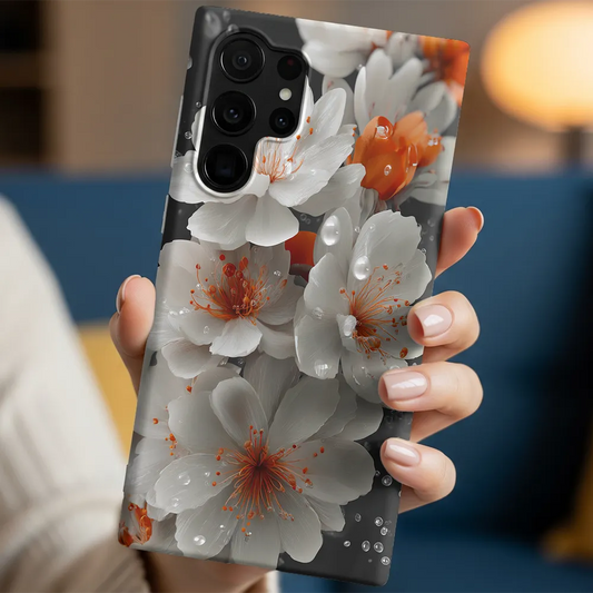 White cherry blossom phone case held in hand, showing calm floral artwork with natures soft detail in everyday use.