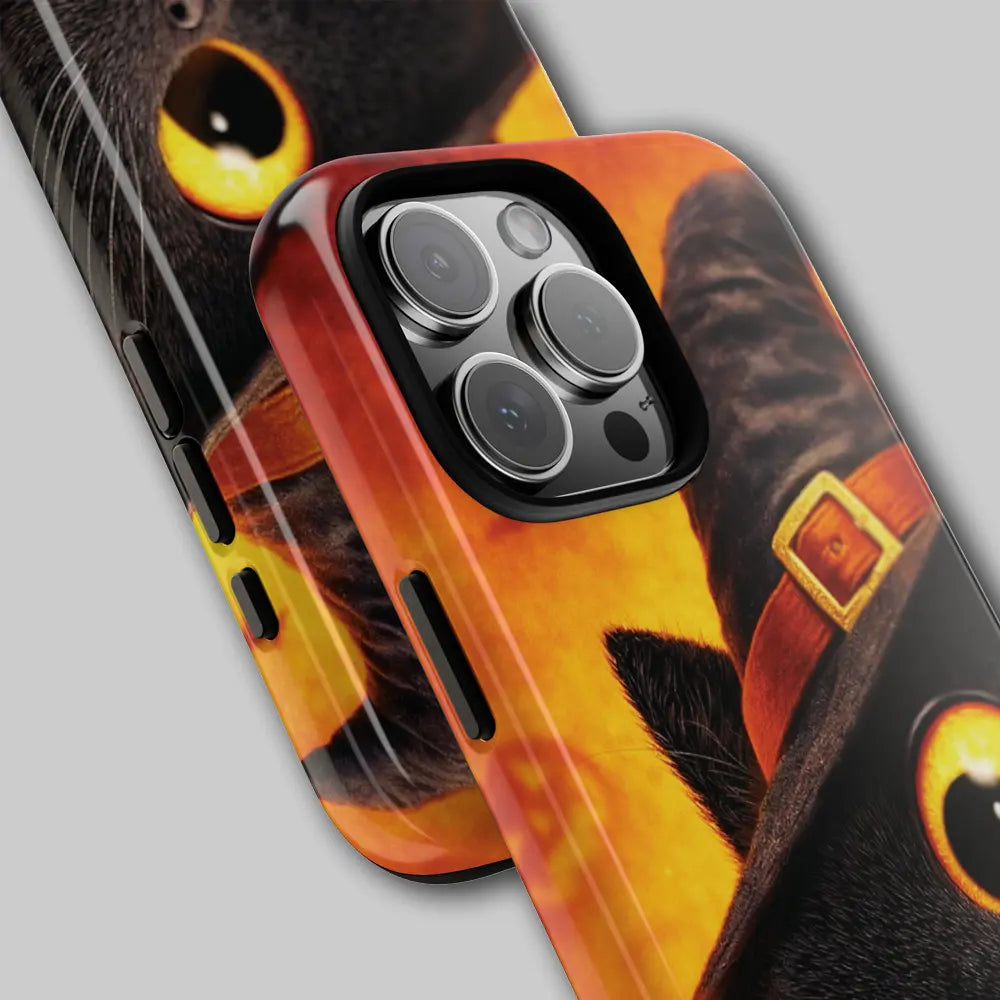 Close-up of witch hat and bat silhouettes on phone case.