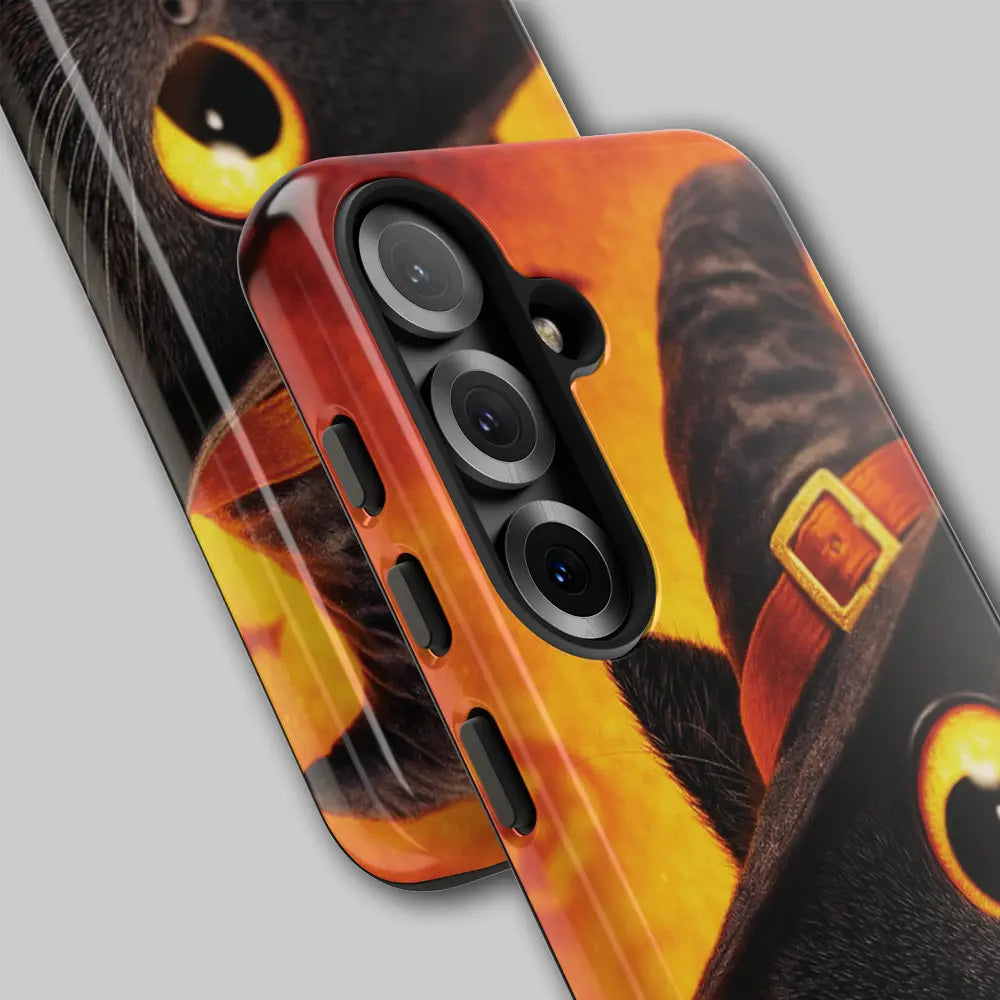 Close-up of witch hat and bat silhouettes on phone case.