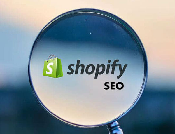 Shopify SEO graphic showing the Shopify logo and the word SEO inside a magnifying glass, symbolizing search visibility and optimization.